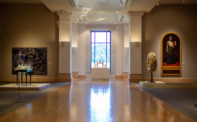 Interior of art gallery showcasing paintings and sculptures in Central Alabama.