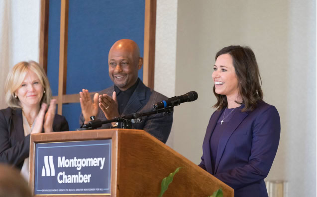 Group of diverse professionals speaking at Montgomery Chamber event.