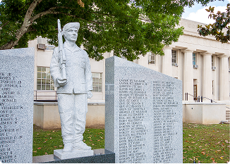 Statue of a soldier with a rifle at a memorial in Alabama.